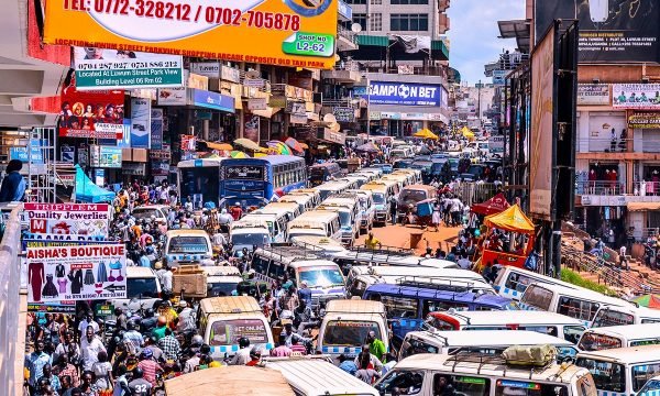 Minibuses, or taxis, are stuck in a traffic jam in late December in Kampala, Uganda. During the Christmas season, people from across the country come to Kampala to shop leading to a rise in vehicle use. (Nakisanze Segawa, GPJ Uganda)